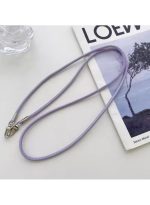 Stylishly designed necklace that attaches to the phone, with a plastic part to secure it to the phone