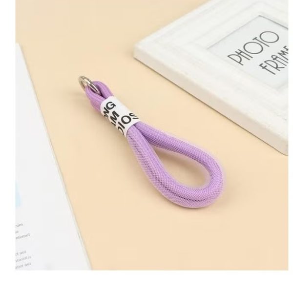 Stylishly designed necklace that attaches to the phone, with a plastic part to secure it to the phone