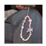 Stylishly designed necklace that attaches to the phone, with a plastic part to secure it to the phone