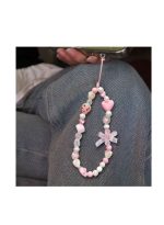 Stylishly designed necklace that attaches to the phone, with a plastic part to secure it to the phone