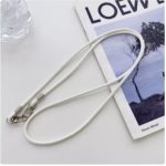 Neck and wrist strap to hold the phone. Fits all smartphones. Comes with a plastic piece to attach to the phone.