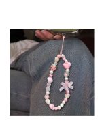 Stylishly designed necklace that attaches to the phone, with a plastic part to secure it to the phone