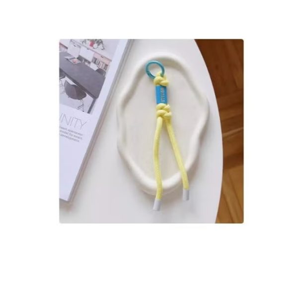 Stylishly designed necklace that attaches to the phone, with a plastic part to secure it to the phone