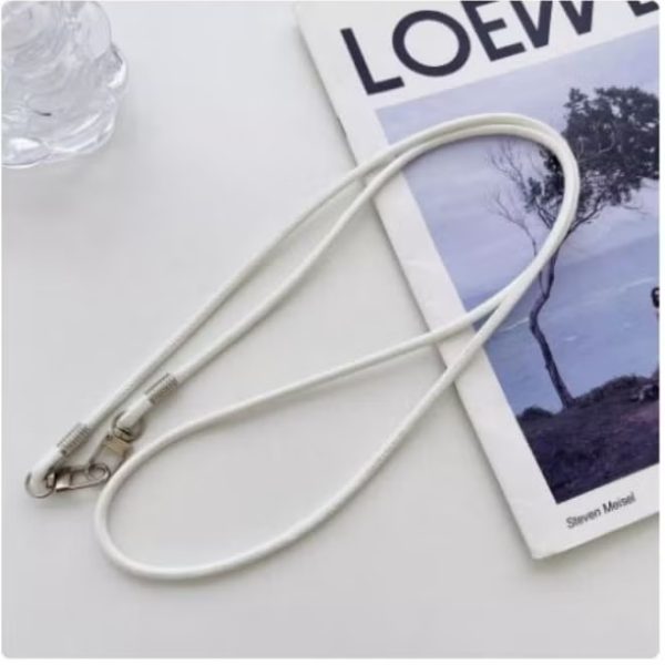 Neck and wrist strap to hold the phone. Fits all smartphones. Comes with a plastic piece to attach to the phone.