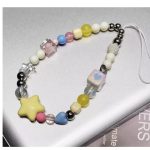 Stylishly designed necklace that attaches to the phone, with a plastic part to secure it to the phone